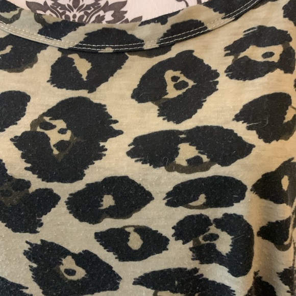 Woman’s long sleeve animal print babydoll top with rounded neckline. - Picture 2 of 8